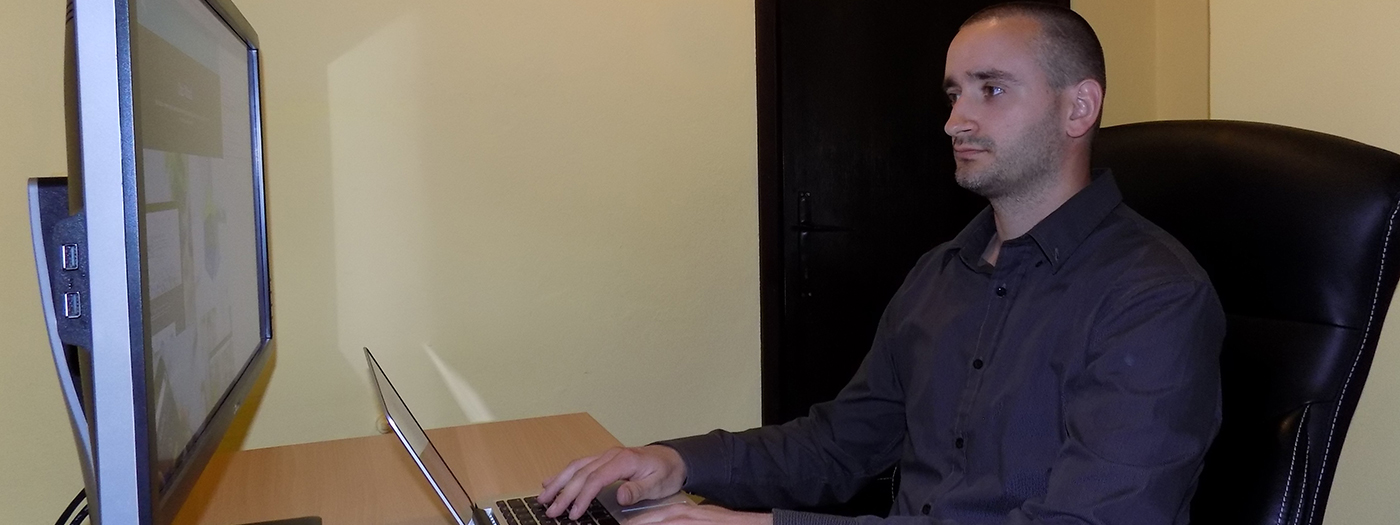 Nebojsa Vilus working at desk